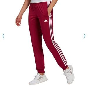 Women’s Adidas Red track pants with white stripes Large